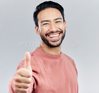 Buy stock photo Asian man, portrait smile and thumbs up for success, good job or winning against a white studio background. Happy male face smiling and showing thumb emoji, yes sign or like for agreement or approval