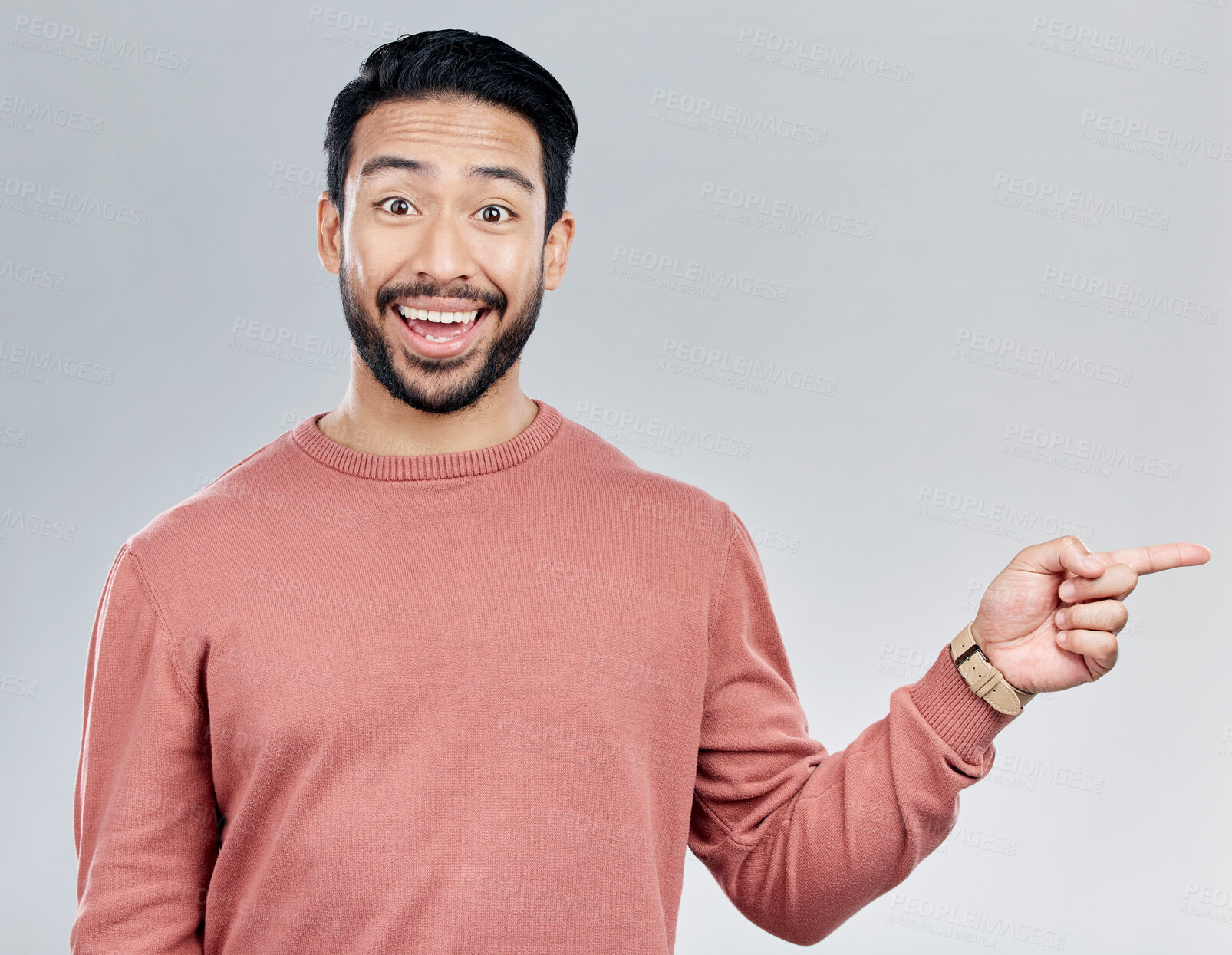 Buy stock photo Excited, gesture and portrait of Indian man pointing at mockup and product placement isolated on white background. Promotion, information and person showing deal space in studio with launch idea.
