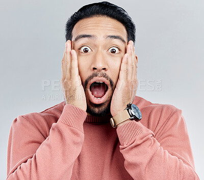Buy stock photo Portrait, surprise and Indian man with hands on face in shock, wow and omg for announcement in studio. Emoji, meme and excited person with shock for gossip, news or information on white background.