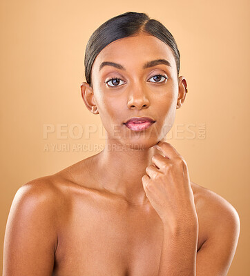 Buy stock photo Serious, beauty and portrait of a woman with makeup isolated on a studio background. Wellness, lifestyle and an Indian model with cosmetics promotion, feminine and looking elegant on a backdrop