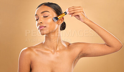 Buy stock photo Indian woman, face and makeup brush and beauty with cosmetic tools and eyes closed on studio background. Skin glow, cosmetology and apply foundation or powder, cosmetics and peace with self care