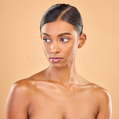 Buy stock photo Beauty, face and skin of woman serious in studio for skincare, cosmetics, dermatology or makeup. Aesthetic female for self care, natural facial and collagen shine results on a brown background