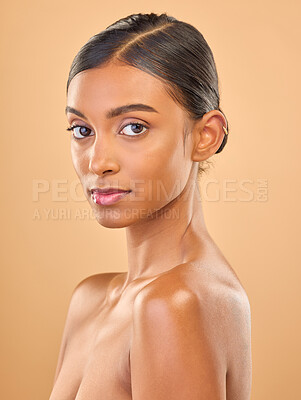 Buy stock photo Face portrait, skincare and beauty of woman in studio isolated on a brown background. Makeup, natural cosmetics and serious Indian female model with spa facial treatment for healthy or flawless skin.