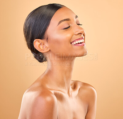 Buy stock photo Beauty, face and smile of woman for skincare in studio with cosmetics, dermatology or makeup. Aesthetic female 
laughing for self care, natural skin and spa facial shine results on a brown background