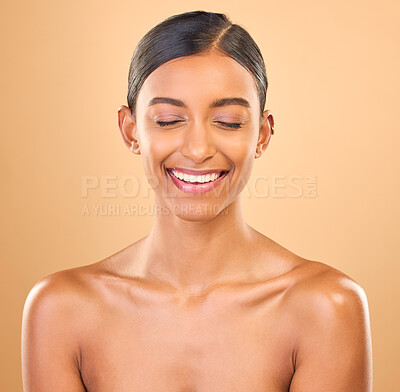 Buy stock photo Beauty, face and smile of woman in studio for skincare, cosmetics, dermatology or makeup. Aesthetic female 
laughing for self care, natural skin and spa facial shine results on a brown background