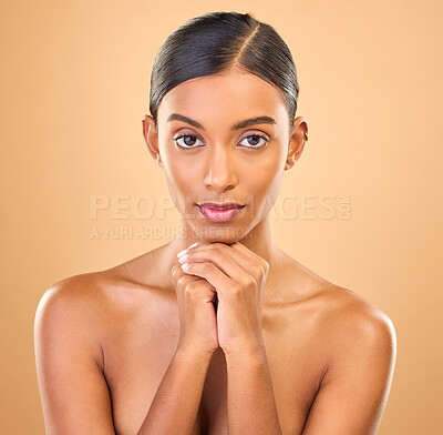 Buy stock photo Face, beauty and portrait of woman in studio for skincare, cosmetics, dermatology or makeup. Aesthetic female 
serious about self care, natural skin and spa facial shine results on a brown background