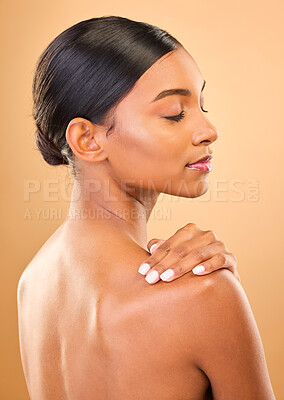 Buy stock photo Beauty, face and skin of woman in studio for skincare, cosmetic, dermatology or makeup. Aesthetic female 
profile and hand for self care, natural glow and facial shine or bodycare on brown background