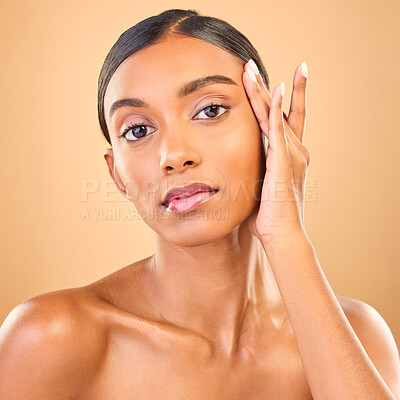 Buy stock photo Skincare, face portrait and beauty of woman in studio isolated on brown background. Makeup, serious cosmetics and confident Indian female model with spa facial treatment for healthy or flawless skin.