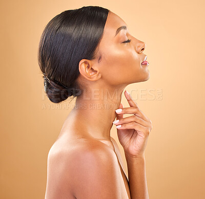 Buy stock photo Face, beauty and skincare profile of woman in studio for cosmetics, dermatology or makeup. Aesthetic female 
hand on skin for self care, natural glow or spa facial shine results on a brown background