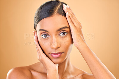 Buy stock photo Skincare, face portrait and beauty of woman in studio isolated on brown background. Natural makeup, cosmetics and confident Indian female model with spa facial treatment for healthy or flawless skin.