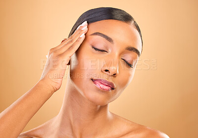 Buy stock photo Beauty, face and skin care of a woman in studio for glow cosmetics, dermatology or makeup. Aesthetic female model for self love, natural glow and spa facial shine results on brown background