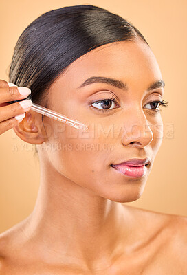 Buy stock photo Skincare, face and woman with serum in studio isolated on a brown background. Dermatology, cosmetics and Indian female model with hyaluronic acid, retinol or essential oil product for healthy skin.