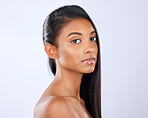 Indian woman, hair care or makeup in studio portrait for strong, healthy natural shine or wellness. Face of glowing young girl model, salon beauty or self care cosmetics grooming on white background