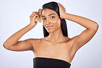 Woman comb hair, beauty and haircare with cosmetics, keratin treatment and smile in portrait on studio background. Indian female, straight hairstyle and skin glow, Brazilian and cosmetic care 