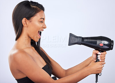 Buy stock photo Happy woman singing, hair care or dryer in studio for healthy natural shine, beauty or wellness. Funny Indian girl model, salon tools or self care equipment in grooming routine on white background