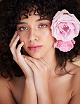 Flowers, makeup and portrait of woman for beauty, cosmetics and haircare for wellness, glamour and glow. Salon, luxury spa and serious face of girl for natural, skincare or facial treatment in studio