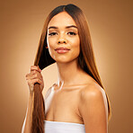 Haircare, hand and strength, portrait of woman in studio holding strong hair with texture and salon shine. Happy model, mockup and beauty, straight hairstyle with keratin product on brown background.