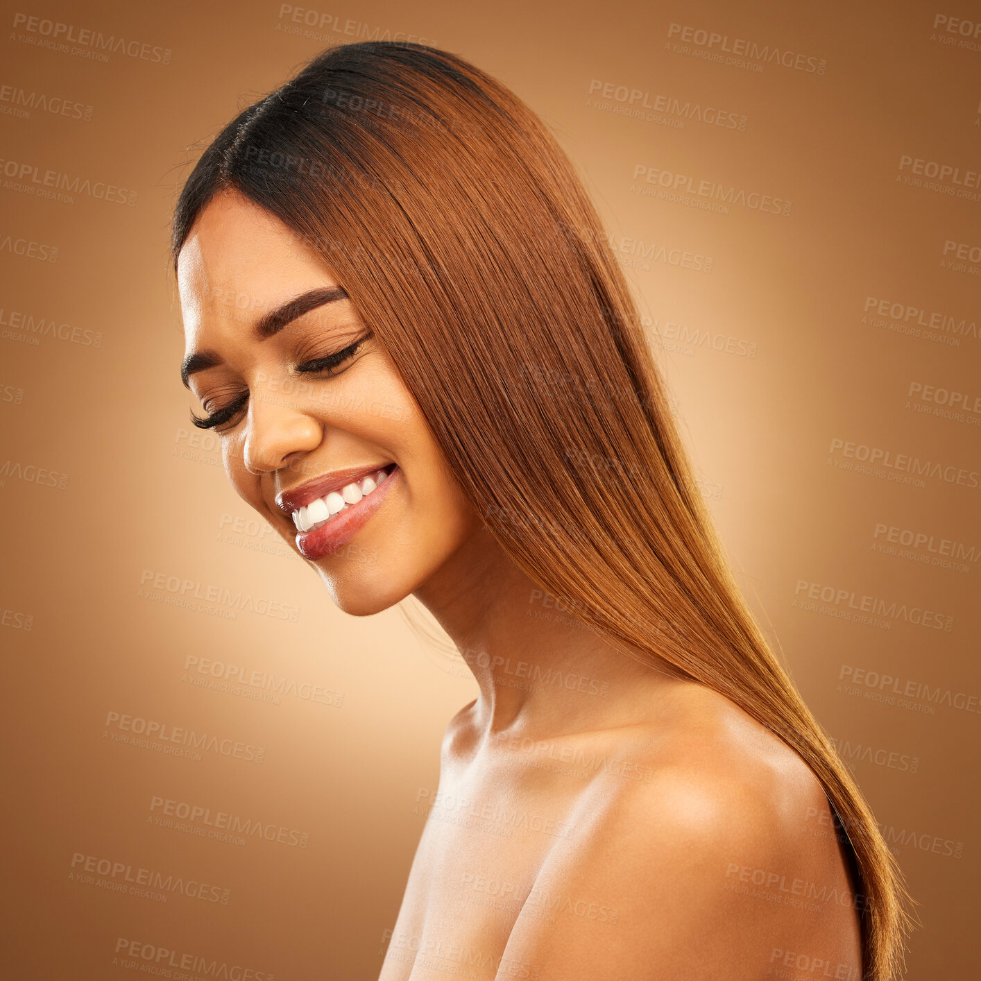 Buy stock photo Smile, beauty and hair care of woman in studio for growth, color shine or healthy texture. Aesthetic female happy for haircare, natural skincare and hairdresser or salon mockup on brown background
