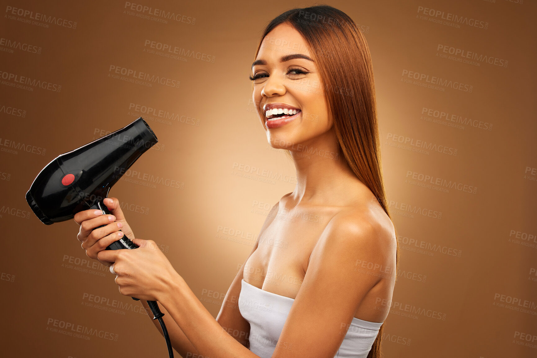 Buy stock photo Hair, hairdryer and smile portrait of woman in studio for growth, color or healthy texture. Aesthetic female hands with heat for haircare, self care and hairdresser or beauty salon brown background
