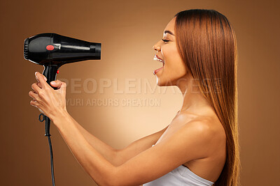 Buy stock photo Beauty, styling and hairdryer with woman in studio for hair care, shampoo and grooming. Salon treatment, glow and self care with model isolated on brown background for results, keratin and cosmetics