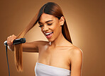 Hair, flat iron and woman with smile in studio for beauty, wellness and keratin treatment on brown background. Hairdresser mockup, salon and girl hairstyle for heat, haircare texture and cosmetics