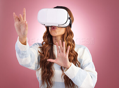 Buy stock photo Virtual reality, metaverse and gaming with a woman using a headset to access the virtual world of innovation. AI, 3D and VR with a female gamer in studio on a pink background using future technology