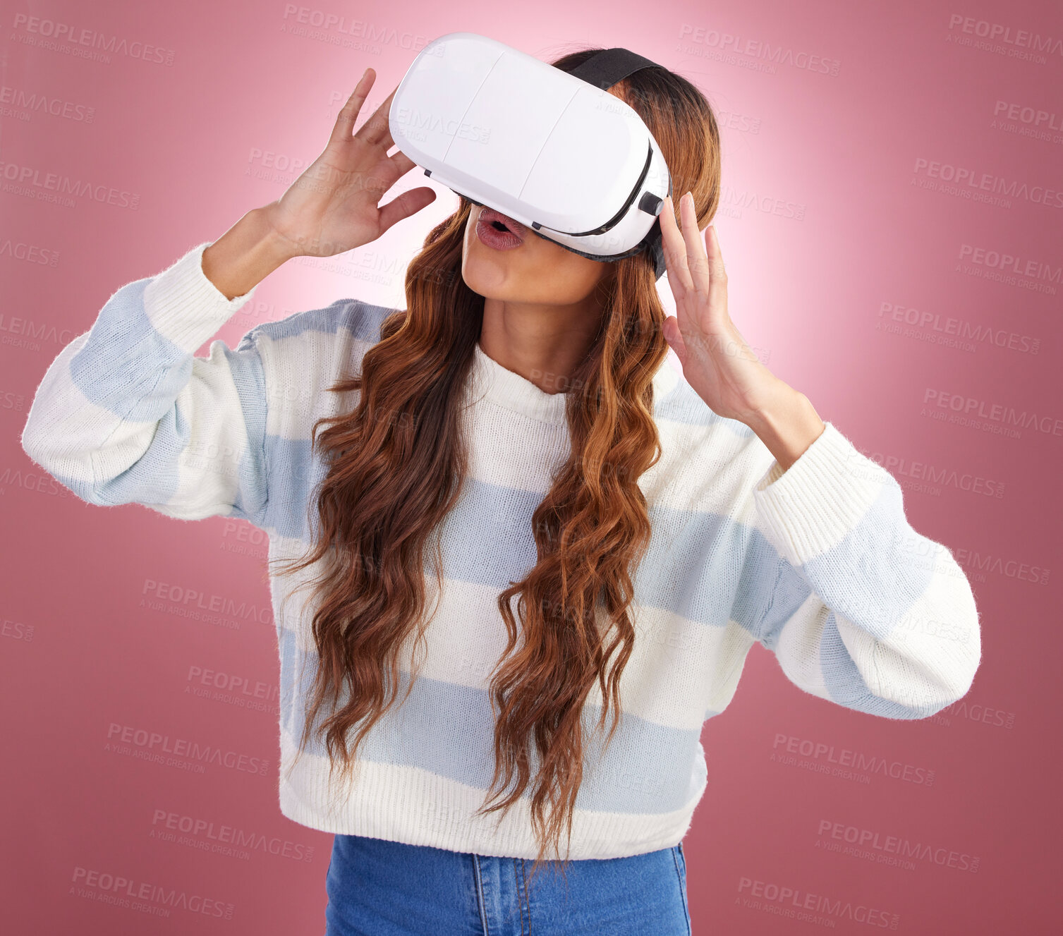 Buy stock photo VR, metaverse and innovation with a woman using a headset to access the online world of gaming. AI, 3D and Virtual reality with a female gamer in studio on a pink background using future technology