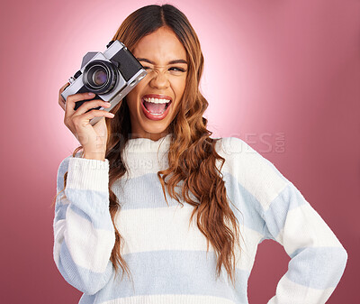 Buy stock photo Camera, photography and happy woman in studio for fun, posing and gen z retro aesthetic on pink background. Lens, photographer and girl posing for picture, photo or photograph on isolated mockup