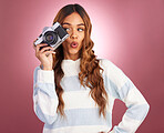 Camera, woman and happy photographer in studio for fun, posing and gen z retro aesthetic on pink background. Lens, photographer and girl posing for picture, photo or photograph on isolated mockup