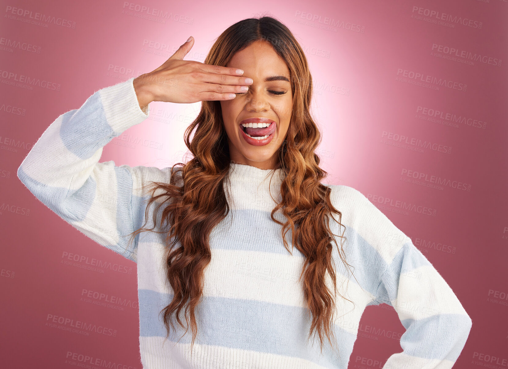 Buy stock photo Hand, woman and tongue out in studio, crazy and having fun against red background. Face, emoji and gen z girl model posing, young and confident, playful and goofy, casual and comic while isolated