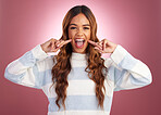 Happy smile, cute woman and portrait in a studio with a gen z female in isolated pink background. Happiness, fun and silly young person with casual fashion feeling crazy and playful from funny joke