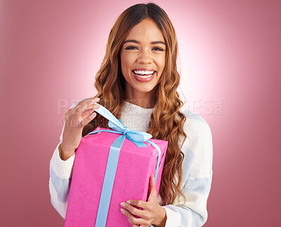 Buy stock photo Gift, portrait and happy woman in studio opening present for birthday, celebration or prize on pink background. Smile, box and face of girl with package, giveaway or party gesture while isolated