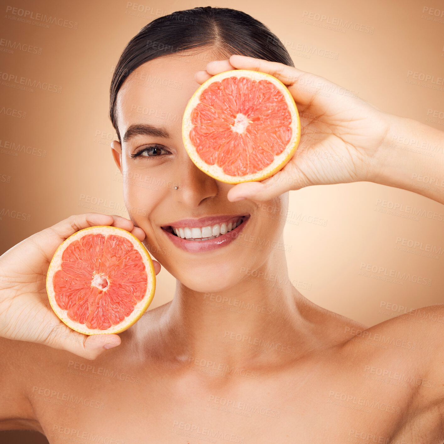 Buy stock photo Beauty, health portrait and happy woman with grapefruit for fruit detox, healthcare or natural facial skincare routine. Vitamin c food product, studio face and female nutritionist on brown background