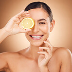 Beauty, health portrait or happy woman with lemon for citrus fruit detox, healthcare or natural facial skincare routine. Vitamin c food product, studio face or female nutritionist on brown background