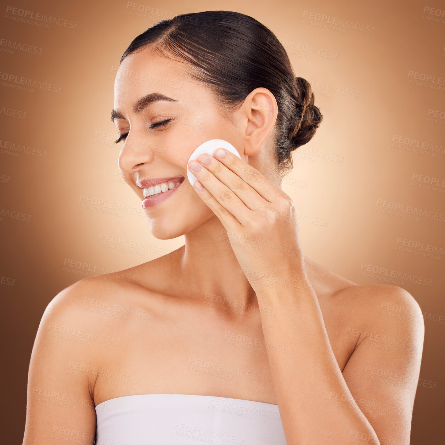 Buy stock photo Skincare, cotton pad and woman face cleaning of a young person with happiness in a studio. Happy smile and dermatology treatment of a female with cosmetics, spa and cosmetology luxury facial