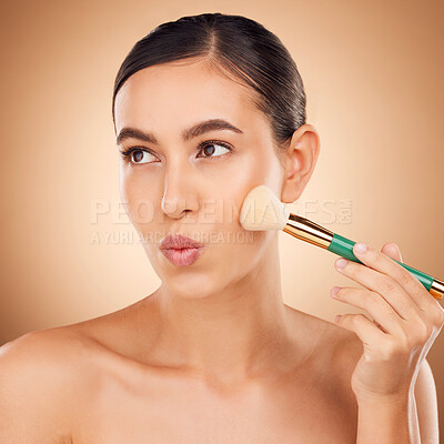 Beauty, cosmetics and makeup, woman with brush on face, aesthetic brown  background and studio. Skincare, salon facial and luxury spa cosmetic  product application for glowing skin on elegant model.