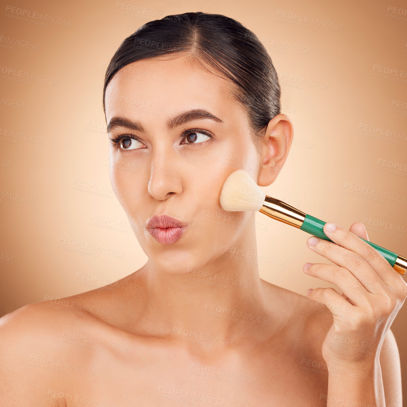 Buy stock photo Beauty, cosmetics and makeup, woman with brush on face, aesthetic brown background and studio. Skincare, salon facial and luxury spa cosmetic product application for glowing skin on elegant model.