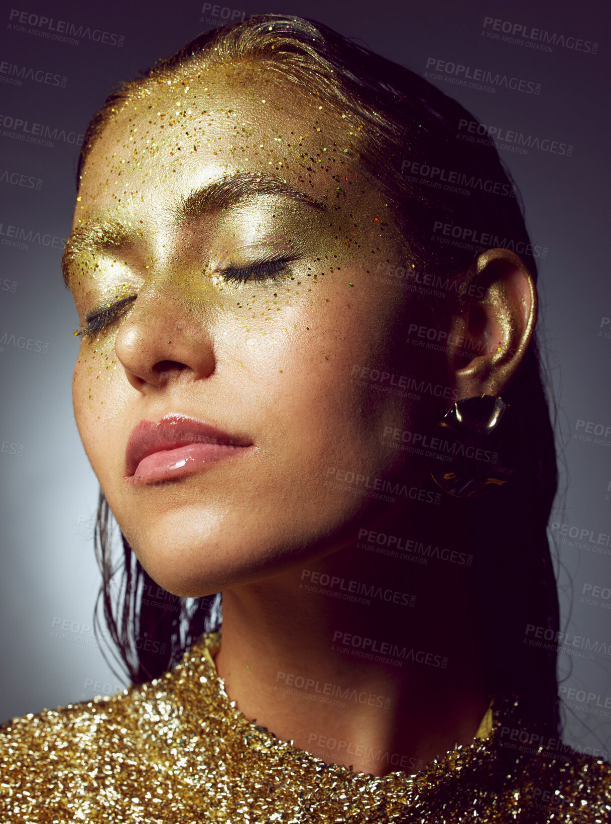 Buy stock photo Gold, woman luxury and beauty sparkle of a female with makeup and cosmetic glitter. Creative fashion, cosmetics and face glow of a young person with eyeshadow shimmer and golden sparkles in studio