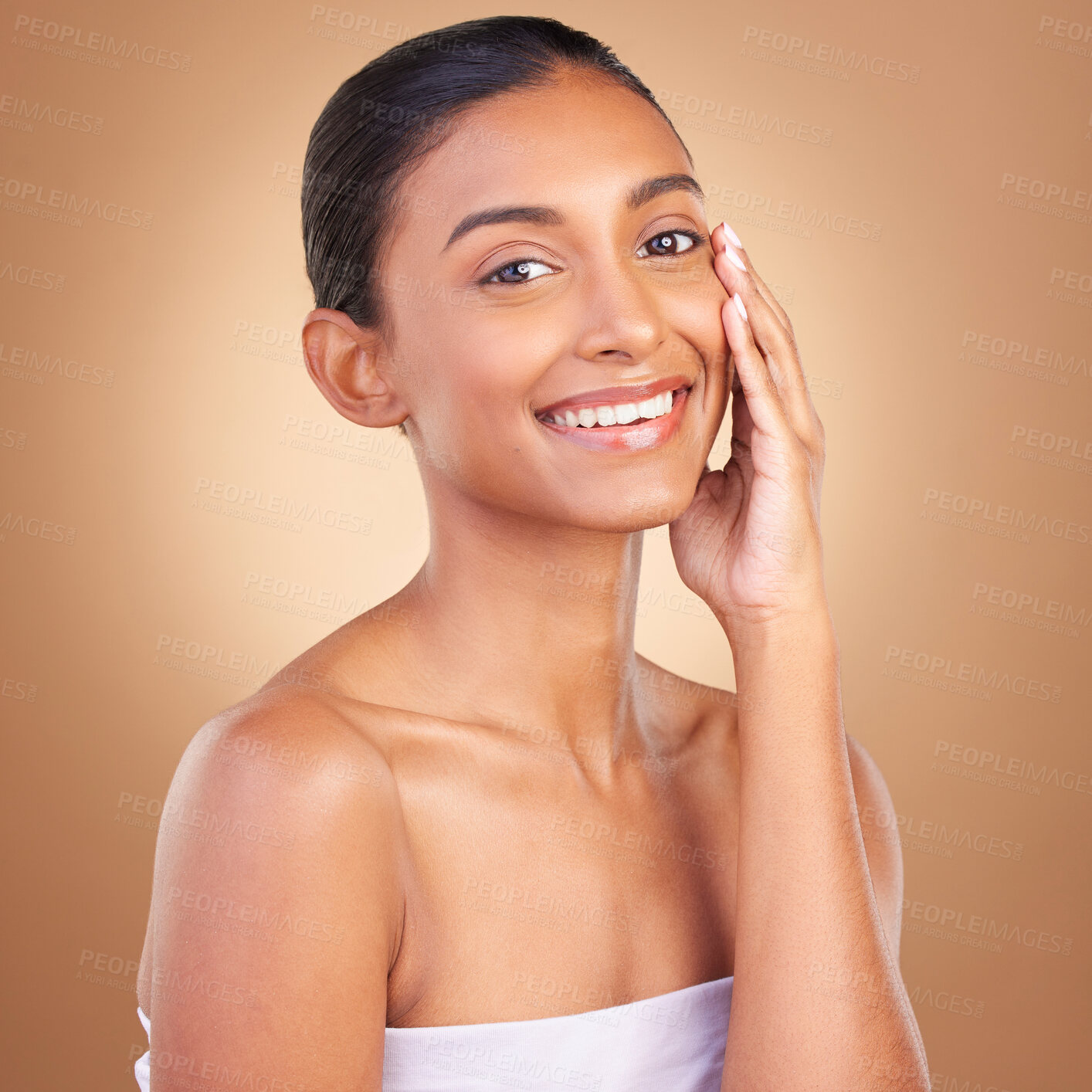 Buy stock photo Makeup, beauty and portrait of Indian woman for skincare, wellness and facial treatment in studio. Dermatology, luxury spa and happy girl touching face for confidence with makeup, cosmetics and smile