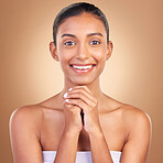 Beauty, skincare and portrait with indian woman in studio for happy, spa treatment and facial. Cosmetics, self care and glow with model on brown background for satisfaction, empowerment or confidence