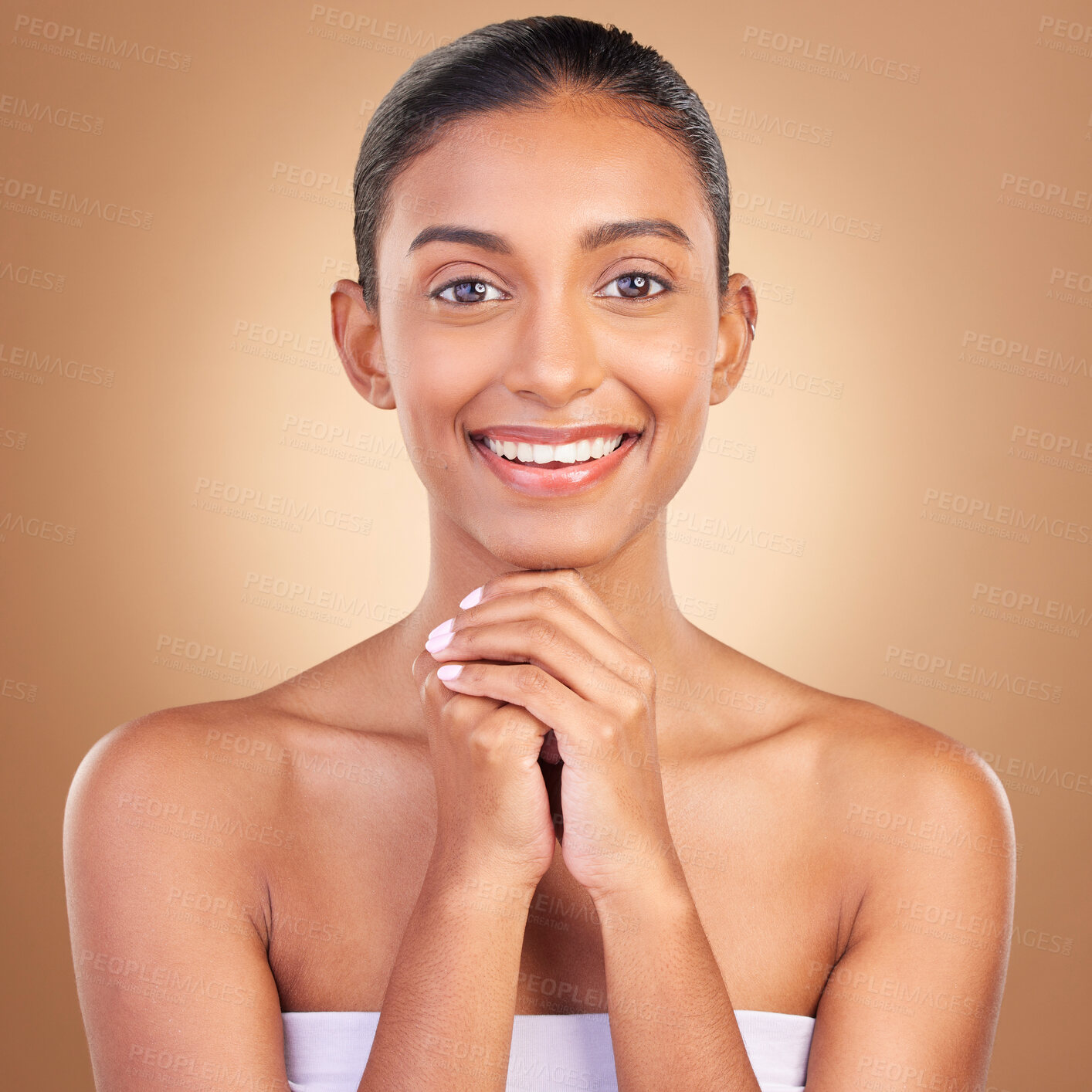 Buy stock photo Beauty, skincare and portrait with indian woman in studio for happy, spa detox and facial. Cosmetics, self care and glow with model on brown background for satisfaction, natural makeup or confidence