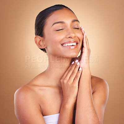 Buy stock photo Face, skincare and touch with indian woman in studio for happy, spa treatment and facial. Cosmetics, self care and glow with model on brown background for satisfaction, empowerment and confidence