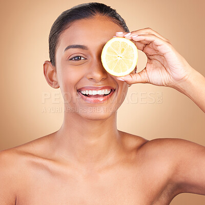 Buy stock photo Skincare, lemon and portrait of a woman with health, wellness and beauty of a young happy model. Studio, smile and healthy fruit with vitamin c and diet nutrition for facial and spa dermatology