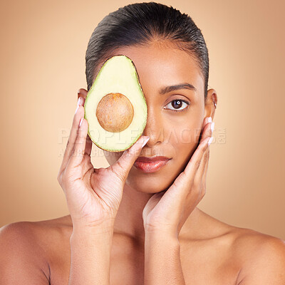 Buy stock photo Woman, beauty and face with avocado and natural skincare in portrait, facial and makeup on studio background. Vegan, cosmetic care and product from nature, organic and female with hands and glow