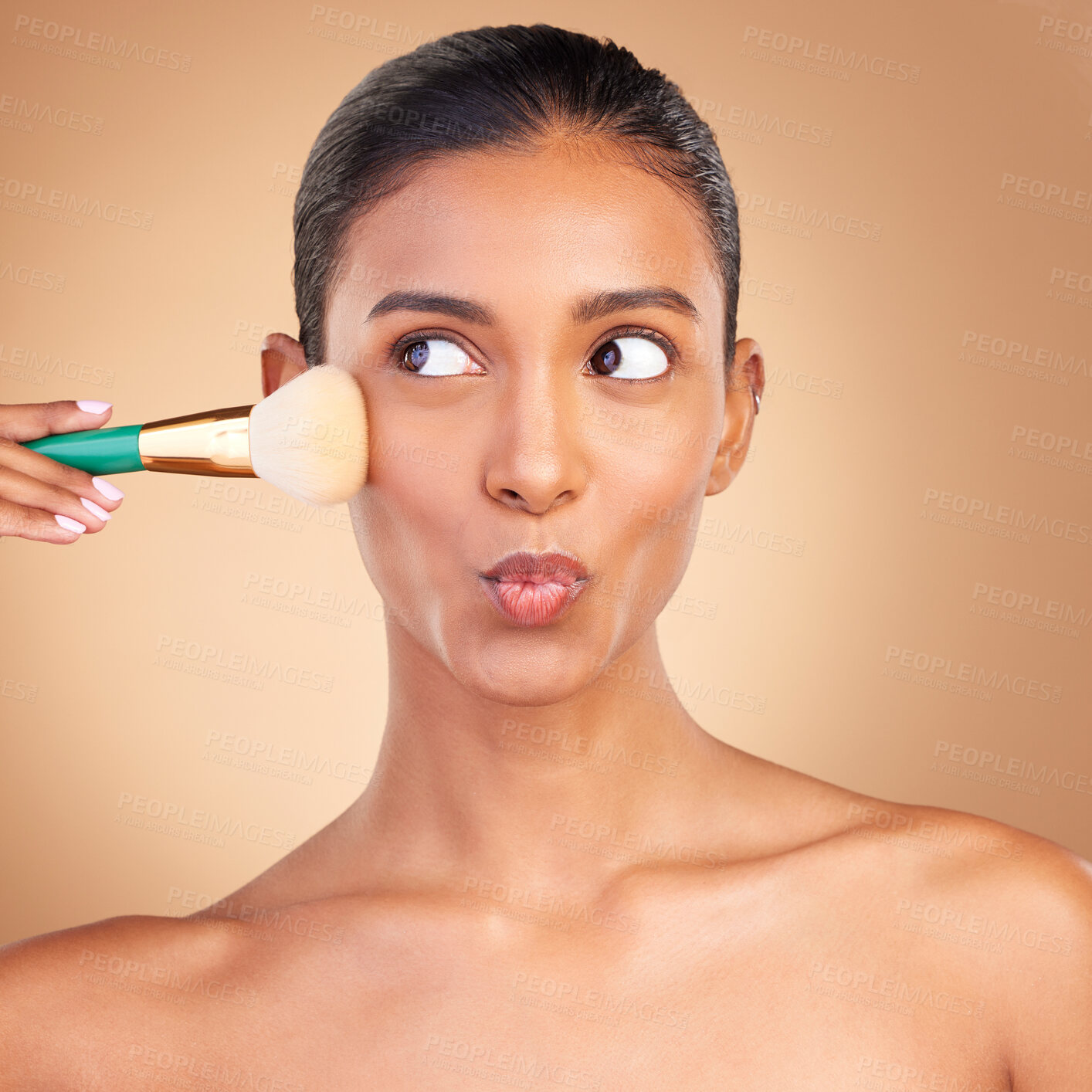 Buy stock photo Makeup, beauty and brush with indian woman in studio for foundation, blush and self care. Glow, cosmetics and facial with female model isolated on brown background for shine, clean and confidence