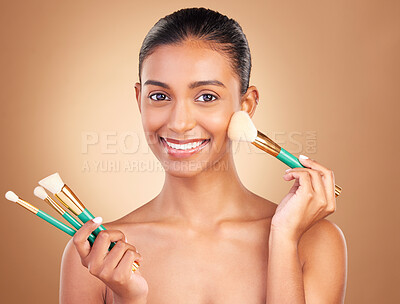 Buy stock photo Cosmetic brushes, portrait and woman with natural beauty, wellness and happiness from cosmetics. Facial skin glow, happy and makeup artist brush of a young female model with self care in a studio