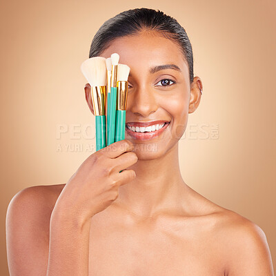 Buy stock photo Makeup brush, smile portrait and woman with natural beauty, wellness and happiness from cosmetics. Facial skin glow, happy and cosmetic artist tool of a young female model with self care in a studio