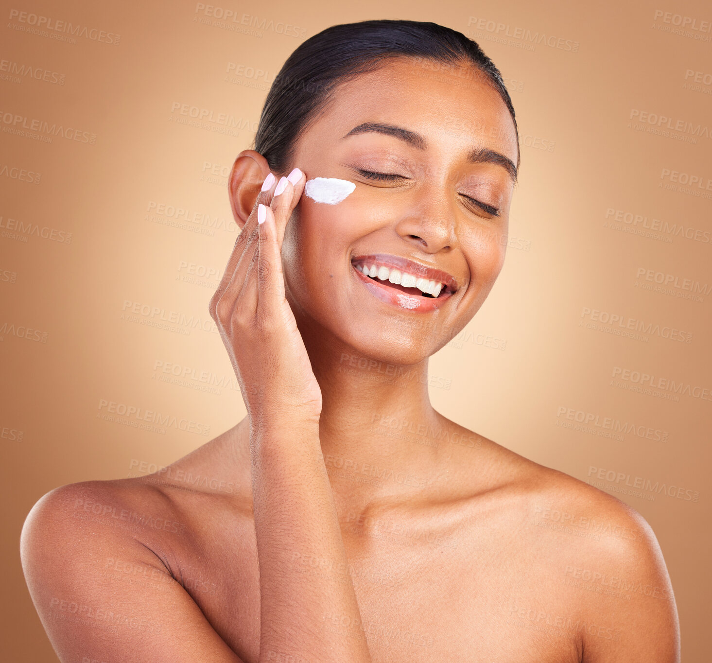 Buy stock photo Skincare beauty, sunscreen and laugh of a happy woman with cosmetic and cream. Isolated, studio background and young model with a smile from face cleaning, cosmetics and dermatology facial product.