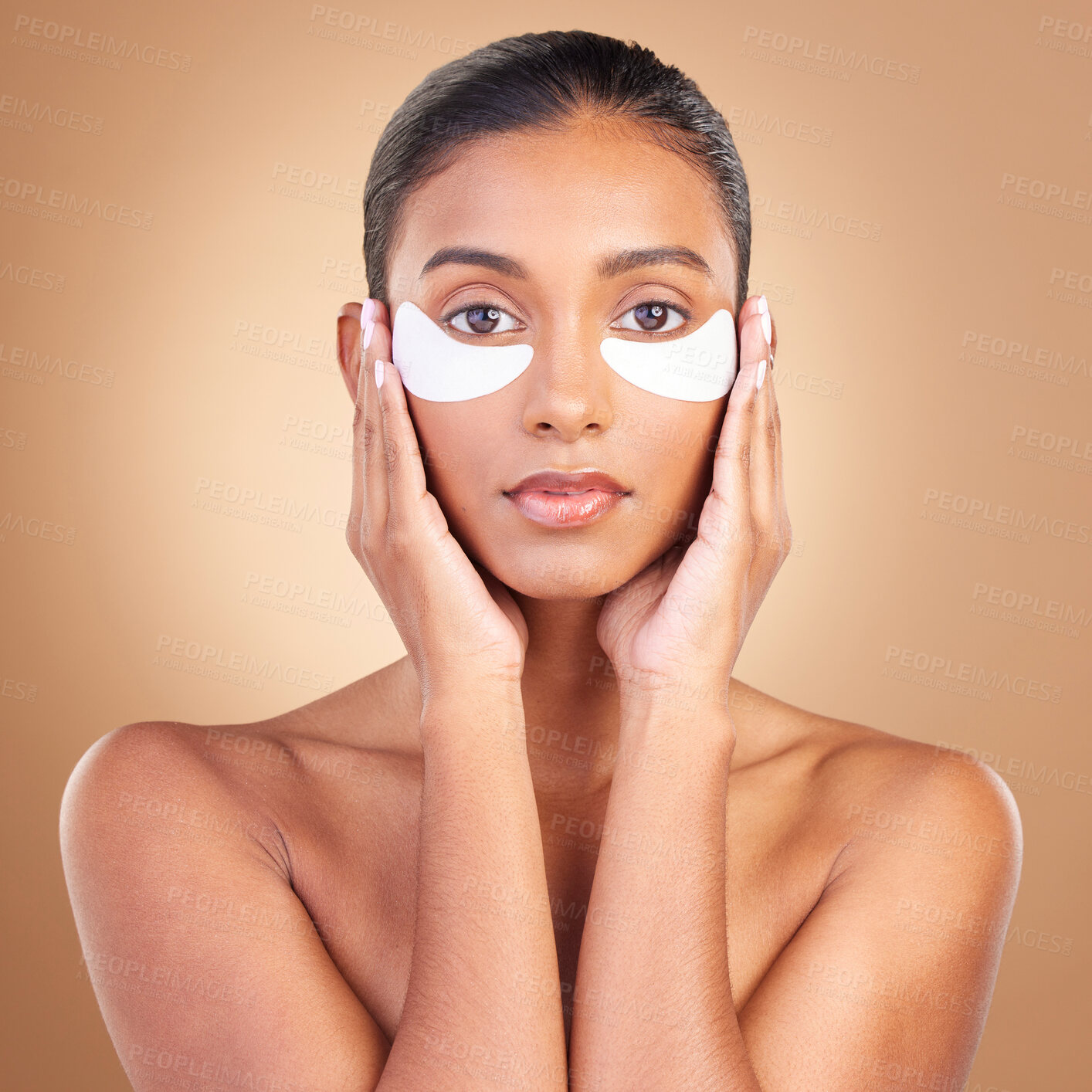 Buy stock photo Skincare, eye patch and beauty with portrait of Indian woman for facial, spa treatment and glow. Self care, cosmetics and hydration with female model on brown background for mask, product and youth