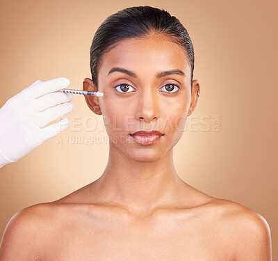 Buy stock photo Woman, face injection and needle with beauty, dermatology and skincare, plastic surgery on studio background. Female in portrait, serious and cosmetic procedure, facelift treatment with healthy skin